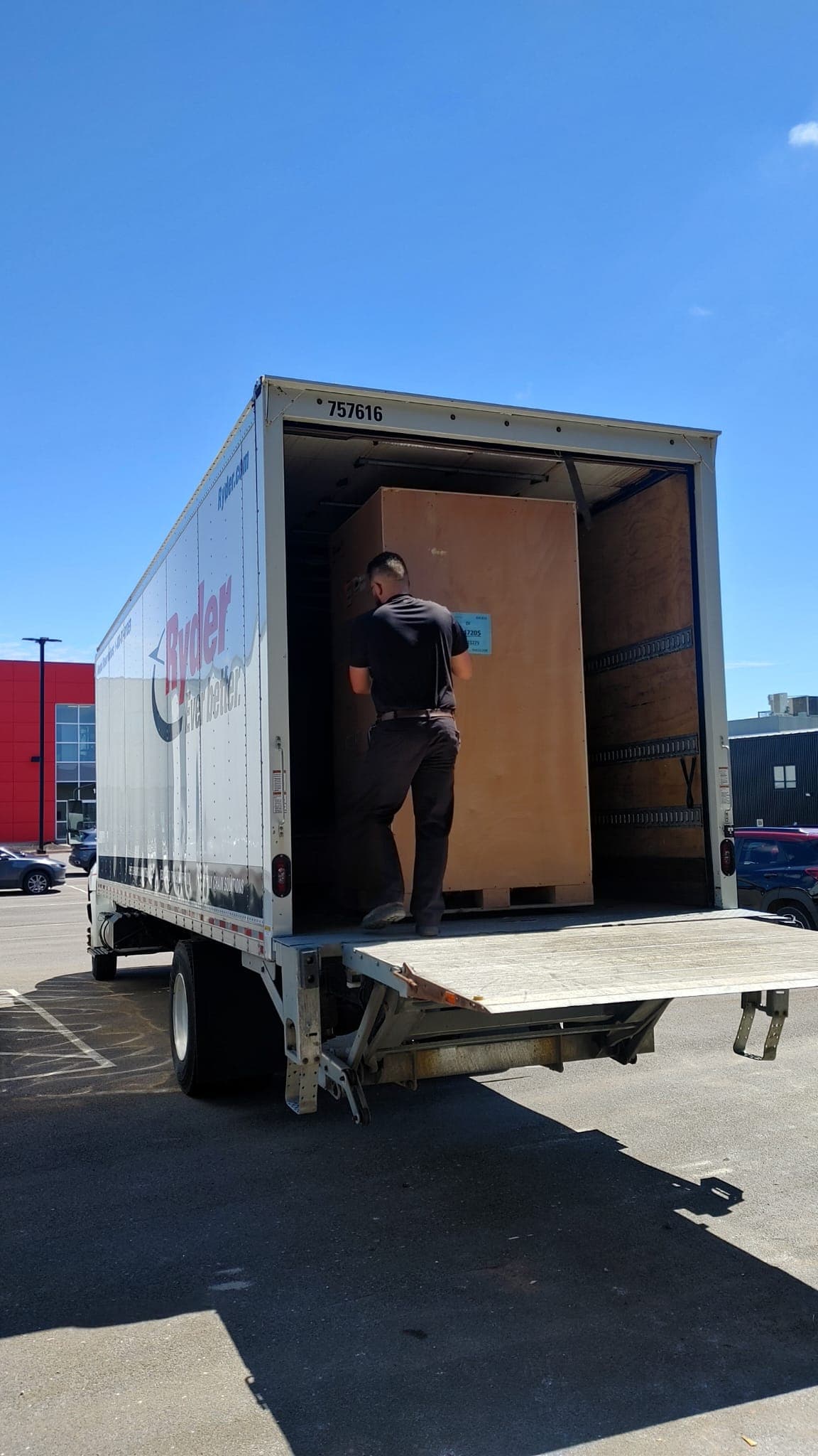MRI scanner crate being unloaded from a delivery truck