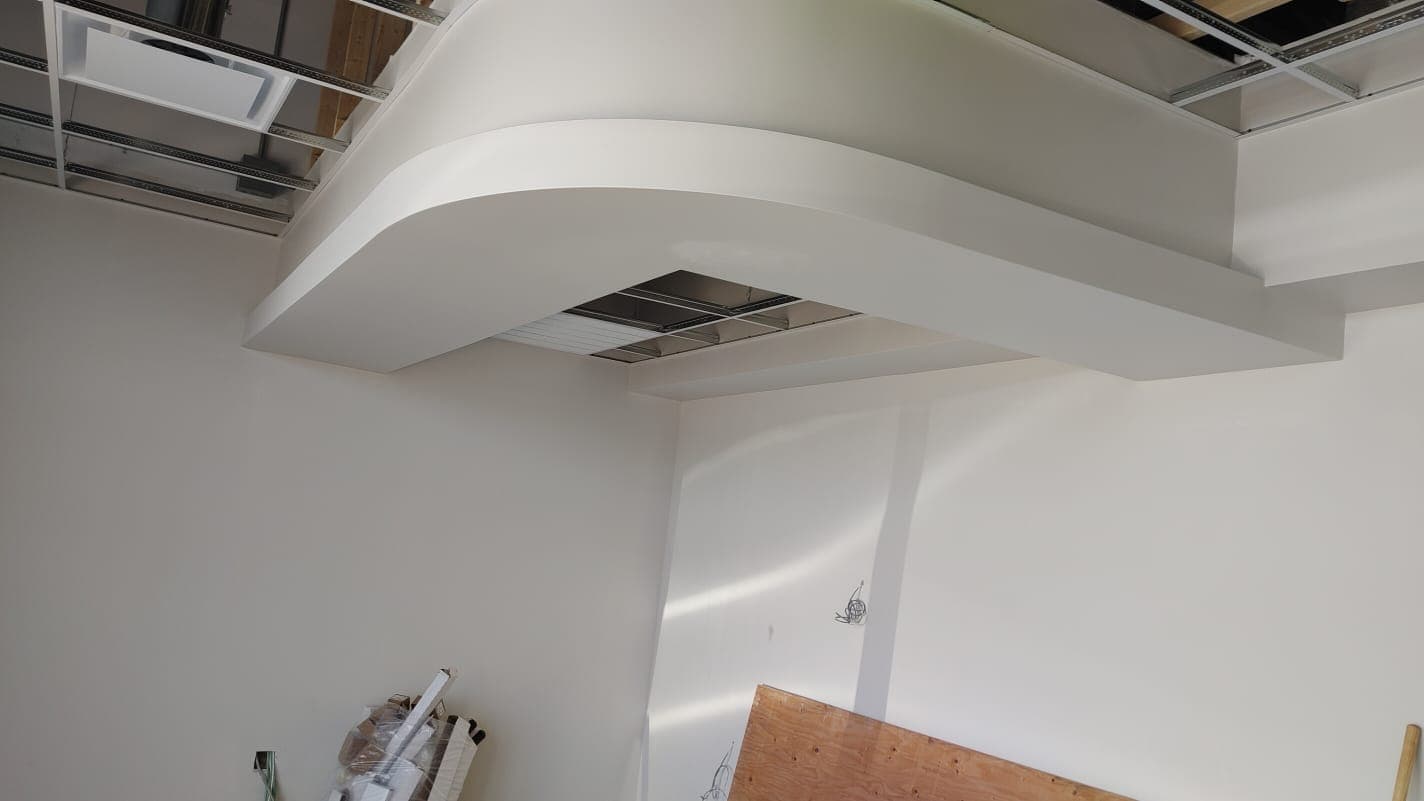 Curved drywall ceiling soffit finished in the interior