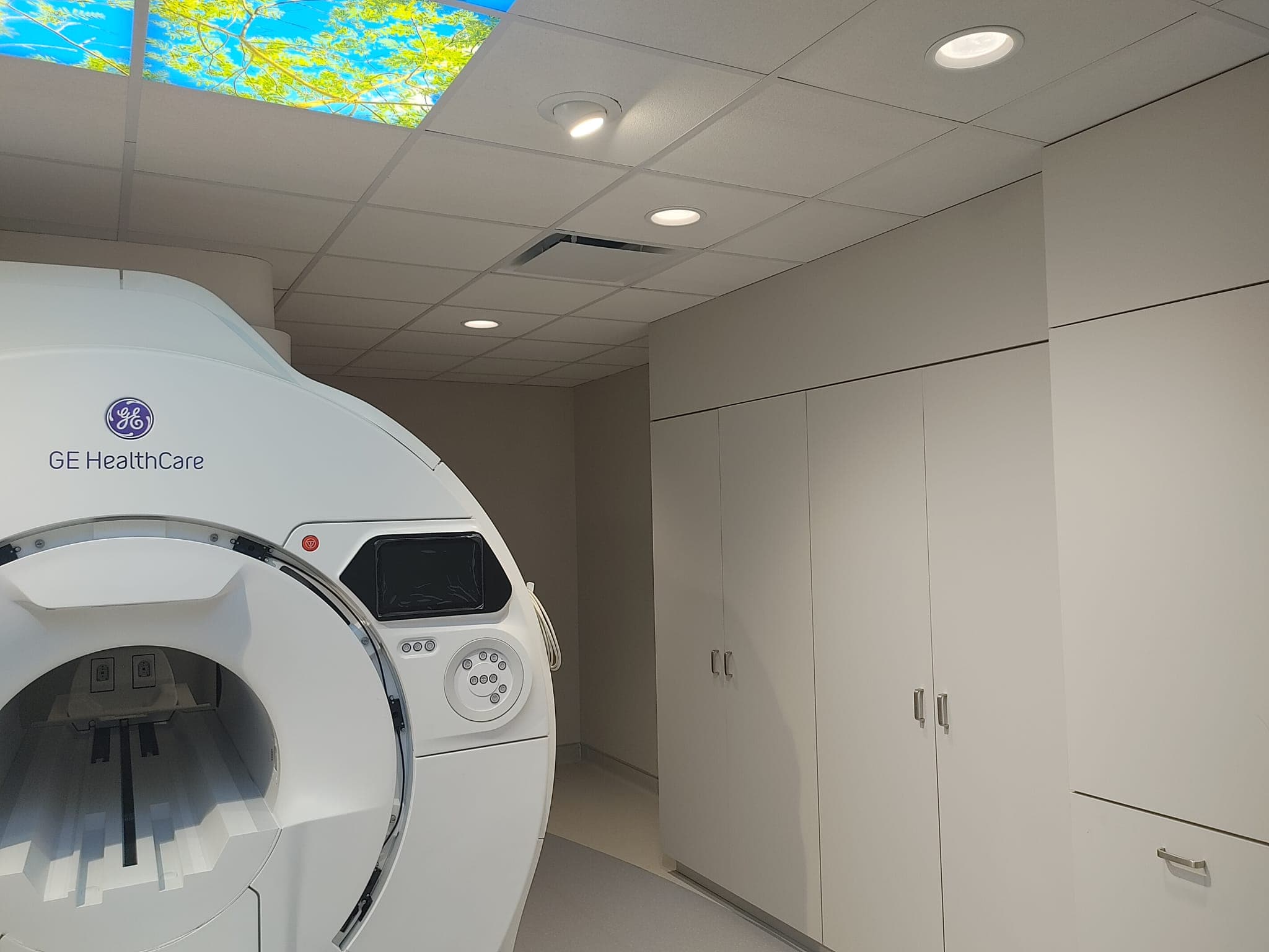 GE HealthCare 1.5T MRI ready for service beneath the sky ceiling